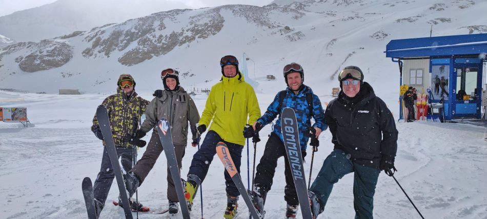 VIA optronics employees posing on the mountains
