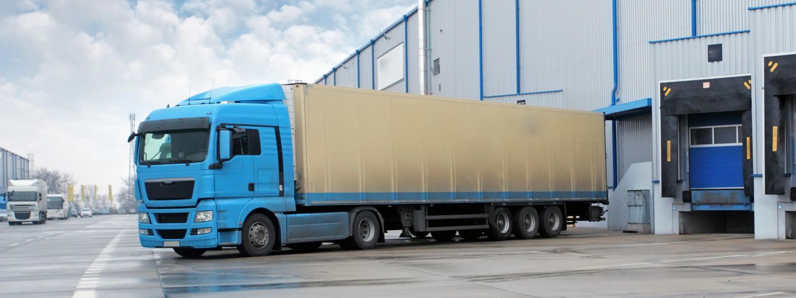 Delivery truck at the loading bay of a logistics center